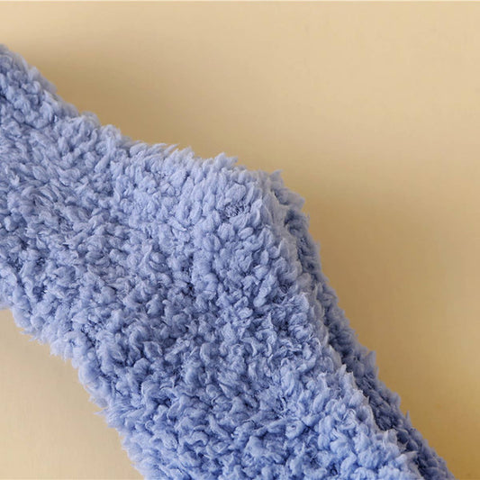 White fluffy sock on a beige background