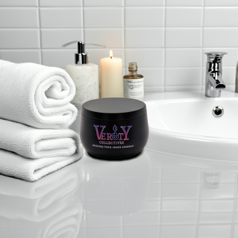 Black container with 'Verity' branding on a bathroom counter with towels and a candle.