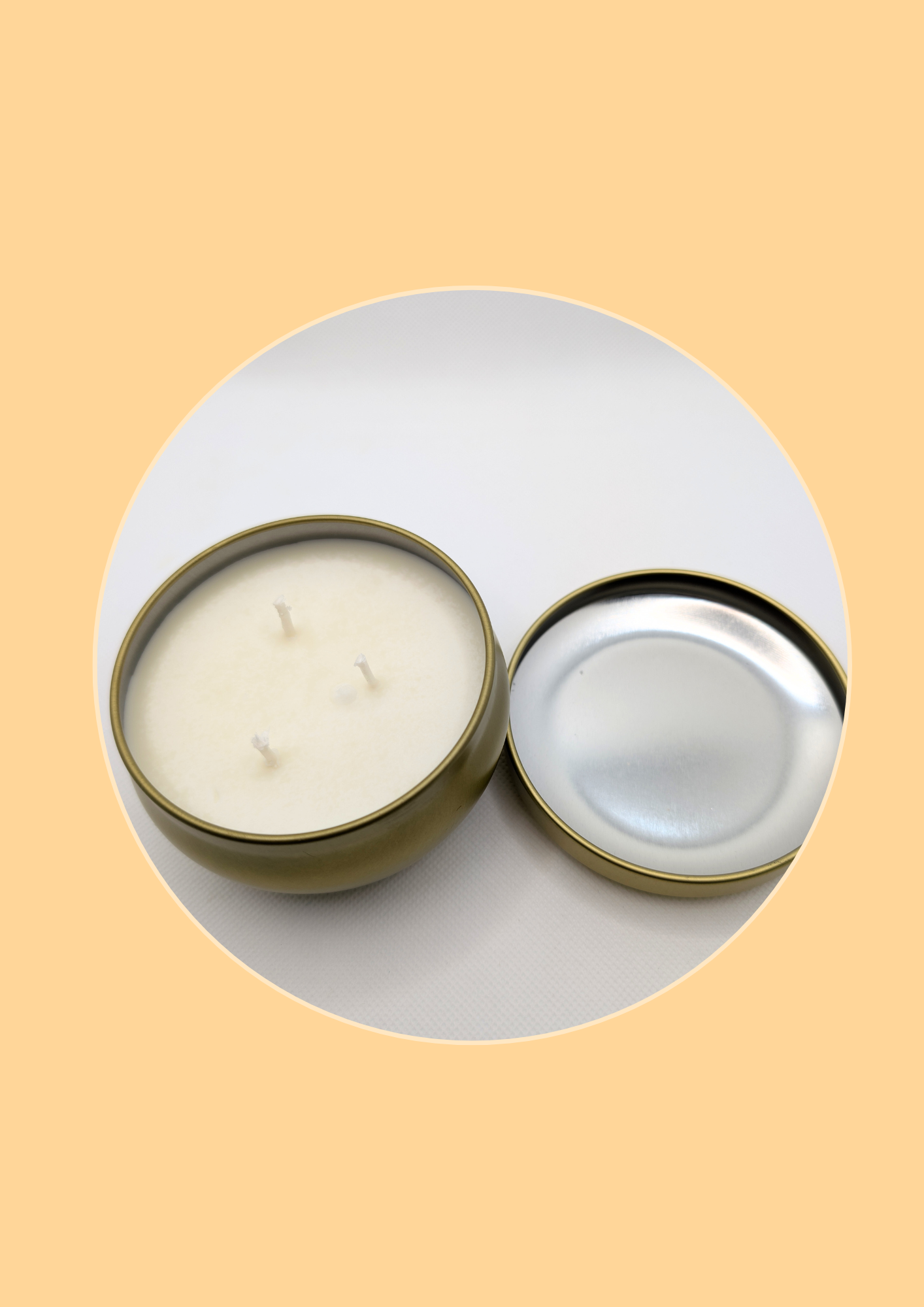 Two candles in metal tins on a beige background with 3 wicks