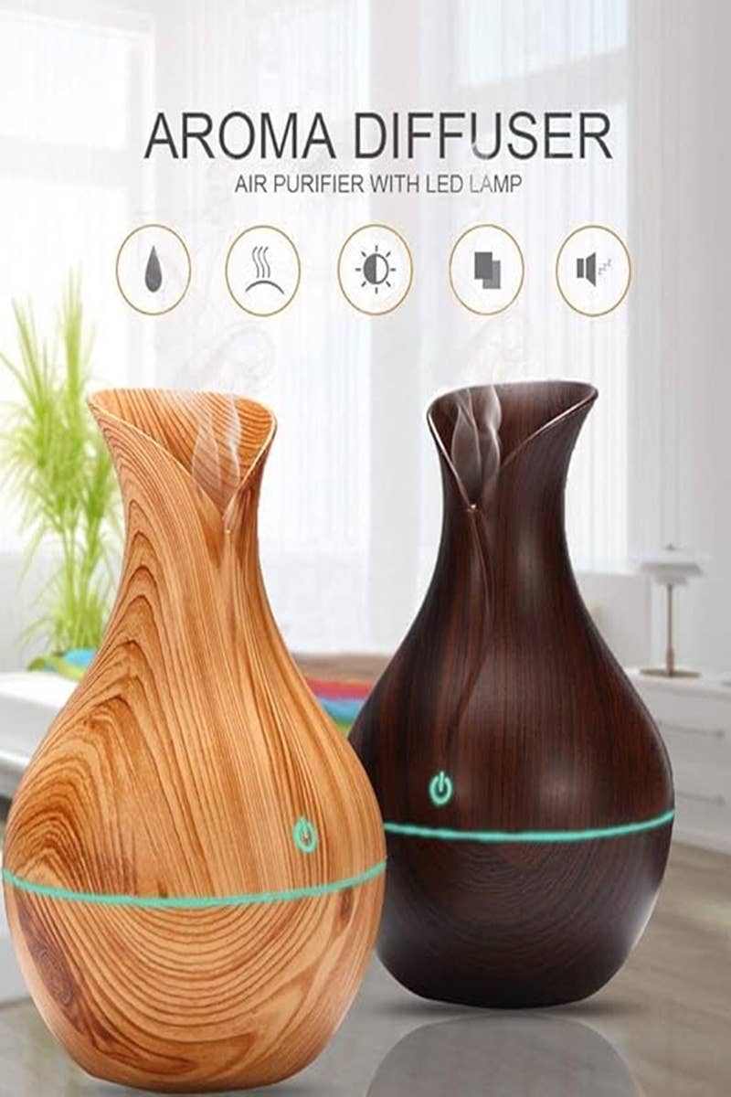 dark brown and light brown woo air purifier with LED lamp with window and plant in background