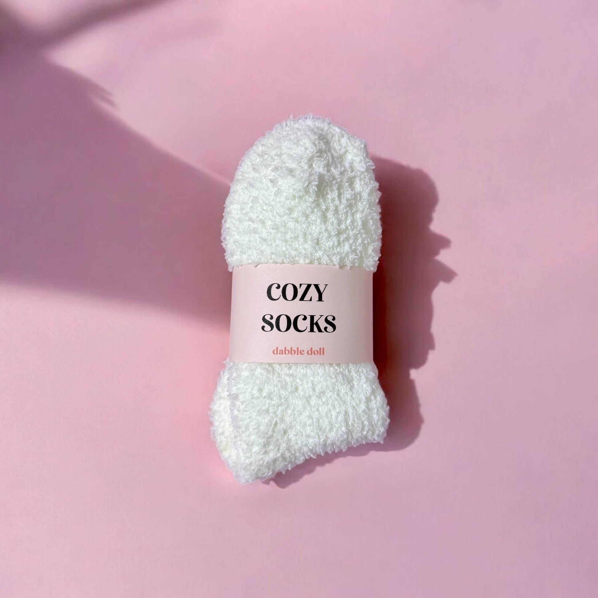 white cozy socks  with pink background