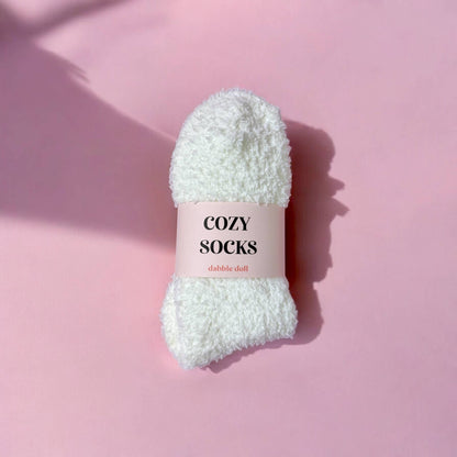 white cozy socks  with pink background