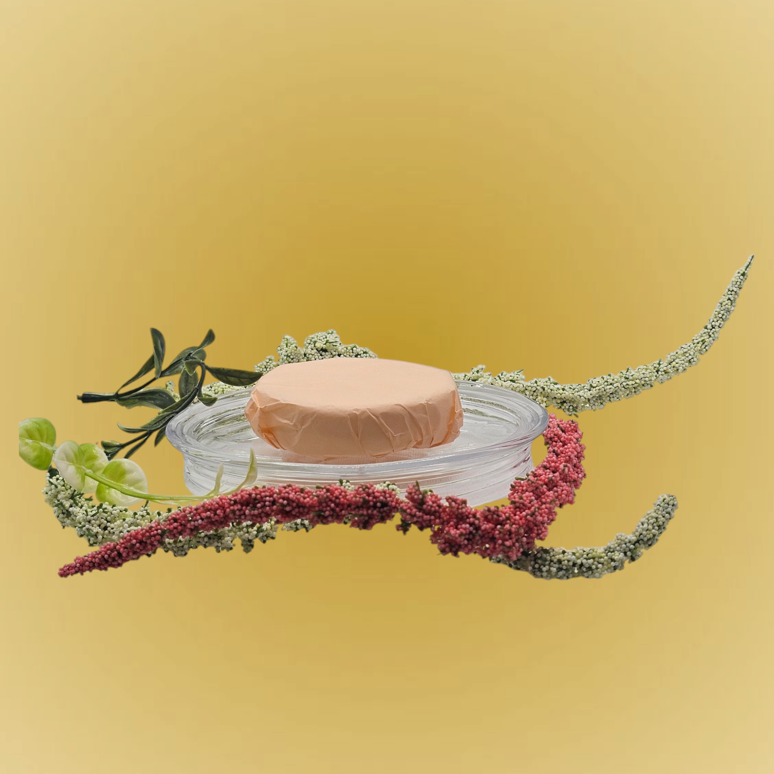 Verity Collectives Crisp Morning Shower Steamer wrapped in peach colored tissue paper with greenish and red flowers and light yellow background