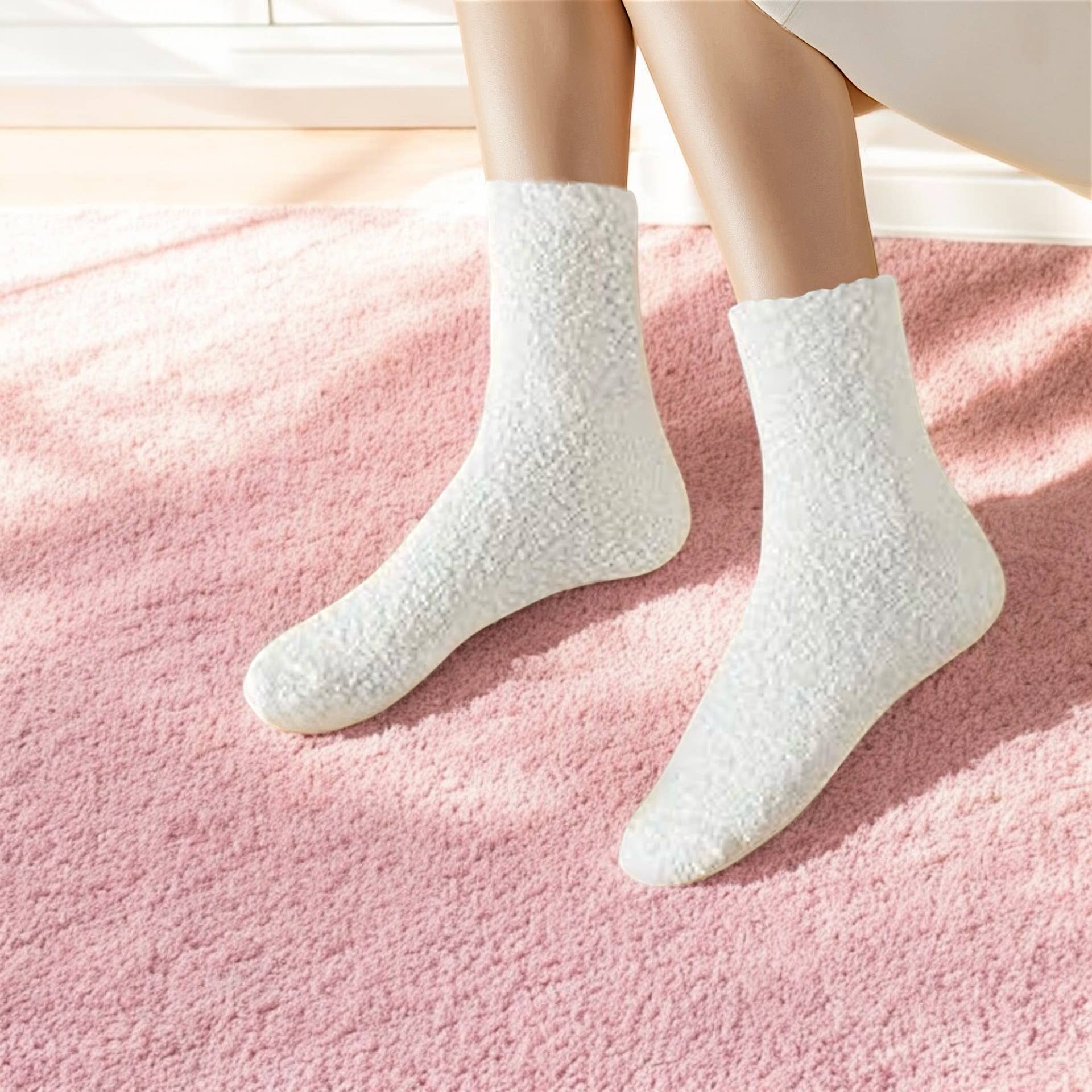 White fuzzy socks on woman with bathrobe on and pink carpet