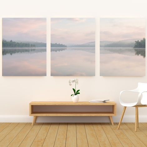 Three-panel misty lake canvas set with blush and pale blue sky, pine-covered shores, and mirror-still water