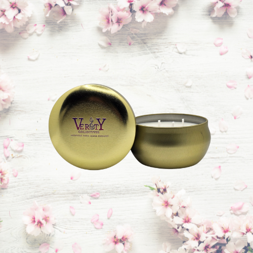 Verity Collectives Gold Honey Apricot Candle with Apricot flowers in the background