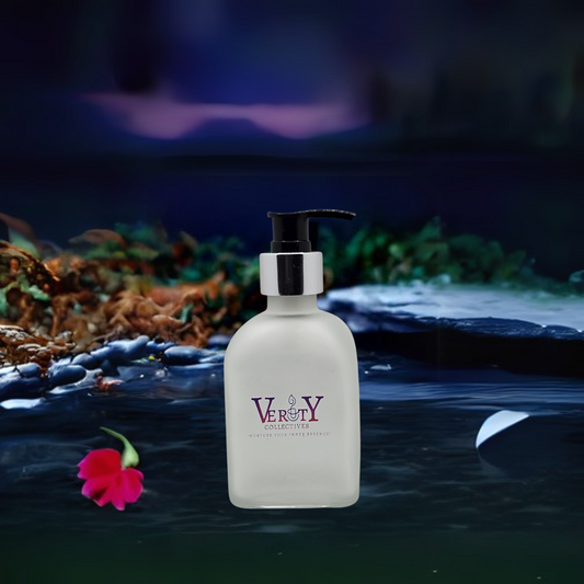 Verity Collectives Midnight Musk Scented Body lotion with black stones, a flower, greenery, and a purple bluish  background