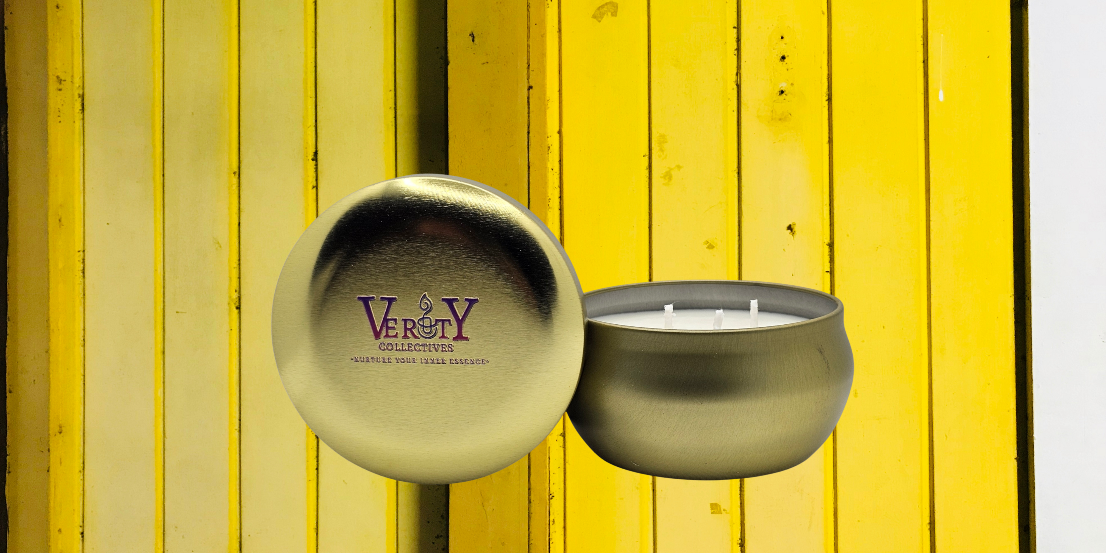 Verity Collectives gold candle with yellow wood panels in the background