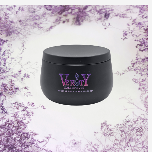 Verity Collectives White Sage Lavender black candle with lavender flowers in the background