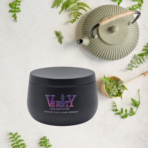 Verity Collectives White Tea Ginger black candle with teapot and green fern leaves in the background