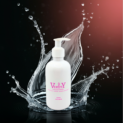 White bottle with pump dispenser surrounded by water splashes on a dark background