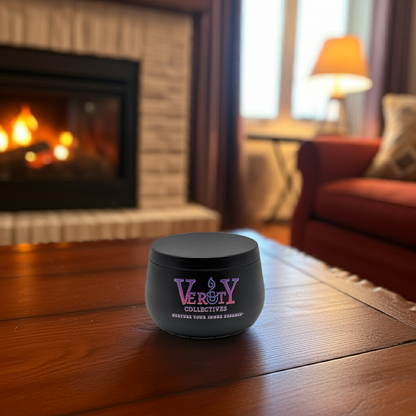 verity collectives candle on wood table in front of fireplace
