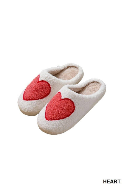 red heart cozy slippers against white background